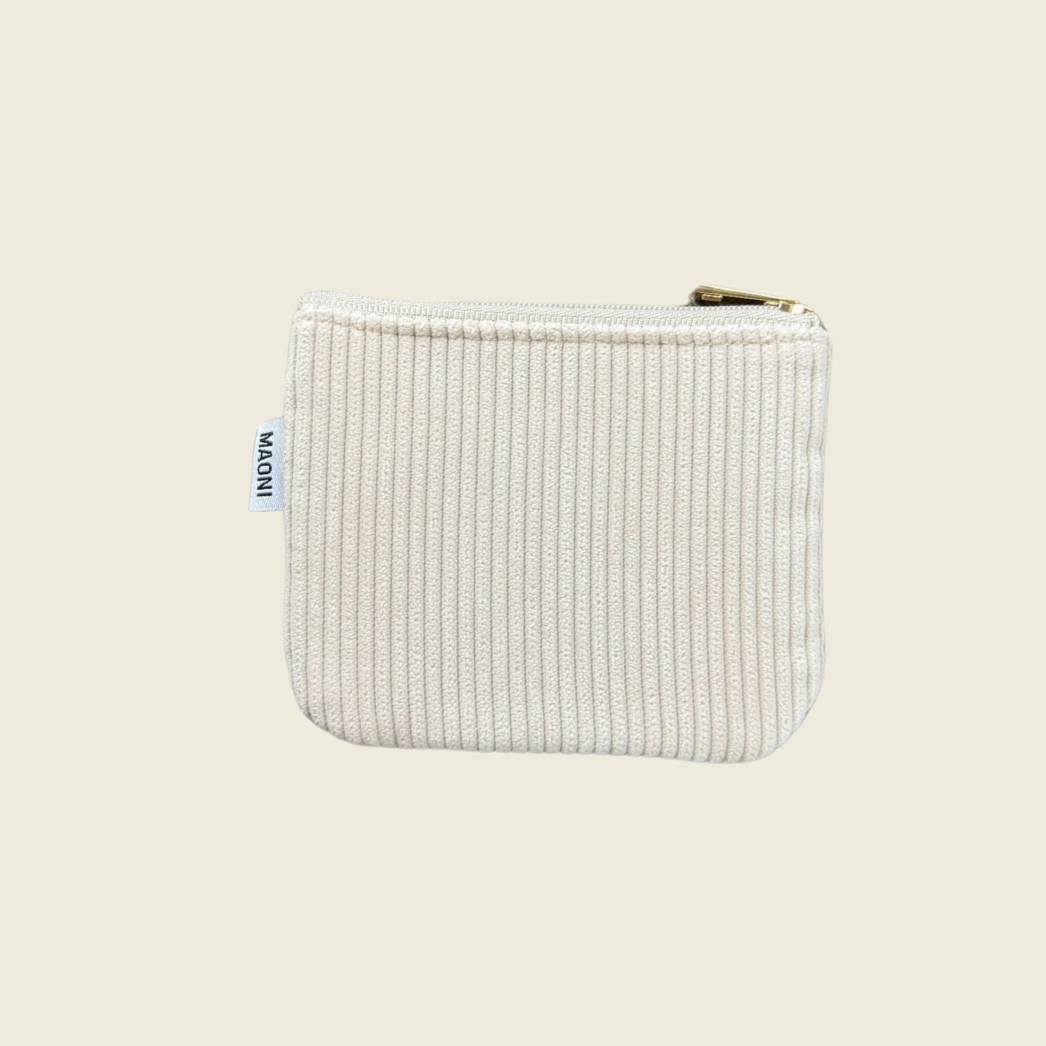 Cord Etui ausgeschnitten auf beige Hintergrund.